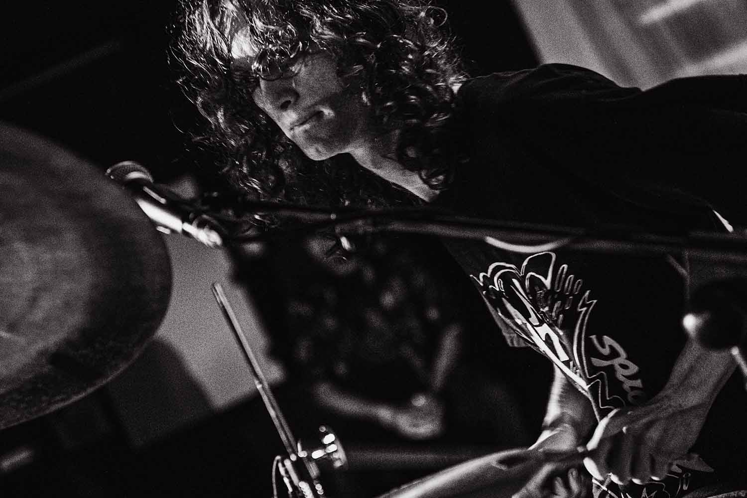Alako Myles, producer, singer and drummer of Liminal performing live at a music festival